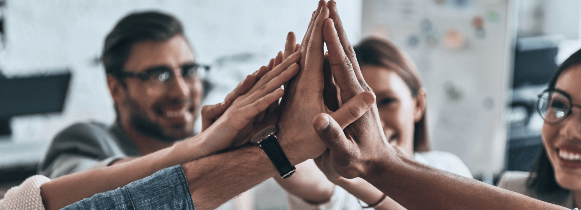 high-five-top-view-business-colleagues-giving-each-other-high-five-symbol-unity-smiling-while-working-board-room 1 (2) (1)